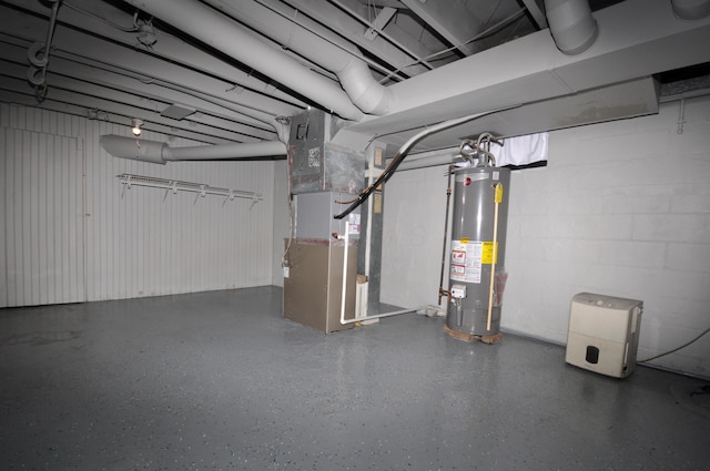 below grade area with concrete block wall, heating unit, and gas water heater