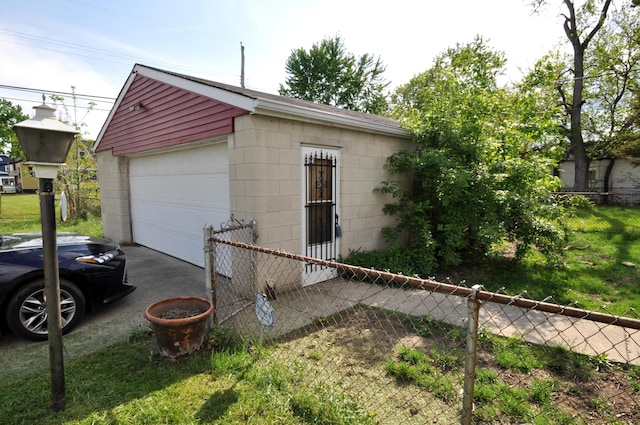 detached garage featuring fence