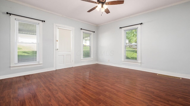 219 W Sheridan Ave, Somerset, OH 43783 - spare room featuring dark wood-type flooring, crown molding, a ceiling fan, and baseboards