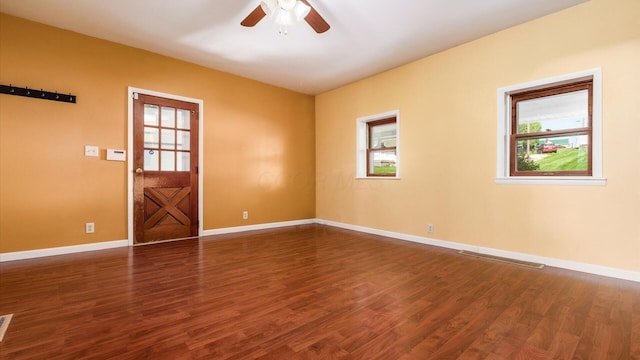 219 W Sheridan Ave, Somerset, OH 43783 - unfurnished room with a ceiling fan, dark wood-style floors, and baseboards