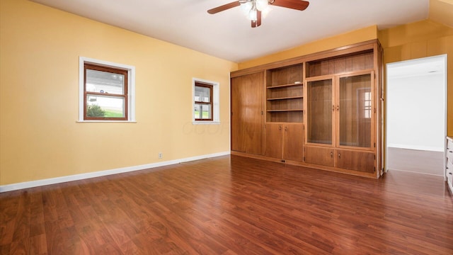 219 W Sheridan Ave, Somerset, OH 43783 - unfurnished living room featuring ceiling fan, dark wood-style floors, and baseboards