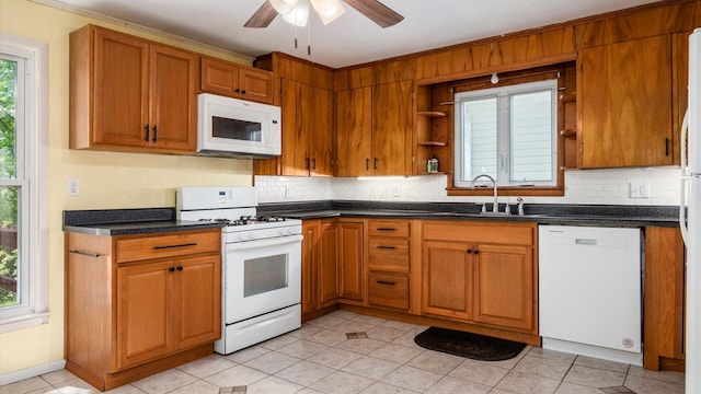 219 W Sheridan Ave, Somerset, OH 43783 - kitchen featuring white appliances, a sink, open shelves, and backsplash