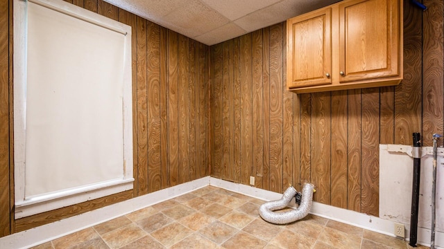 219 W Sheridan Ave, Somerset, OH 43783 - laundry room with cabinet space and wooden walls