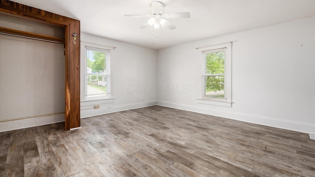 219 W Sheridan Ave, Somerset, OH 43783 - unfurnished bedroom featuring wood finished floors, baseboards, and a ceiling fan