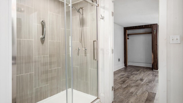219 W Sheridan Ave, Somerset, OH 43783 - full bath with a shower stall, wood finished floors, and baseboards