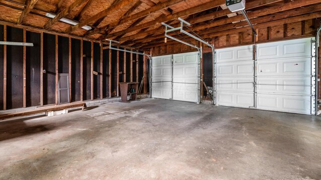 219 W Sheridan Ave, Somerset, OH 43783 - garage featuring a garage door opener