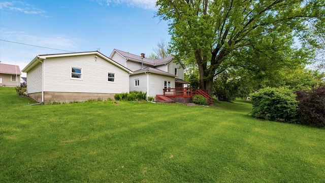 219 W Sheridan Ave, Somerset, OH 43783 - rear view of property with a yard and a deck
