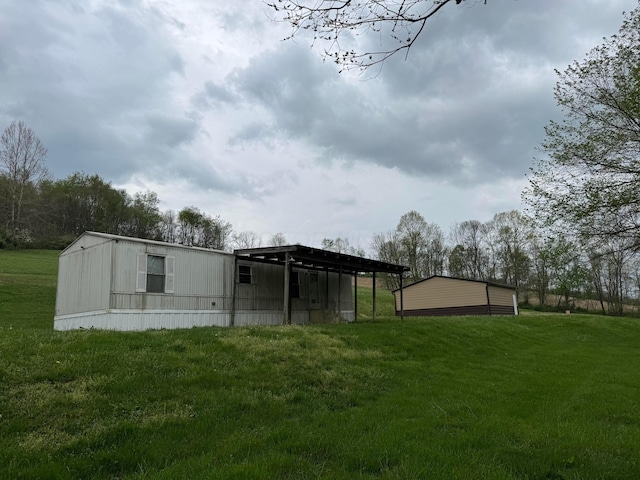 back of house with a lawn
