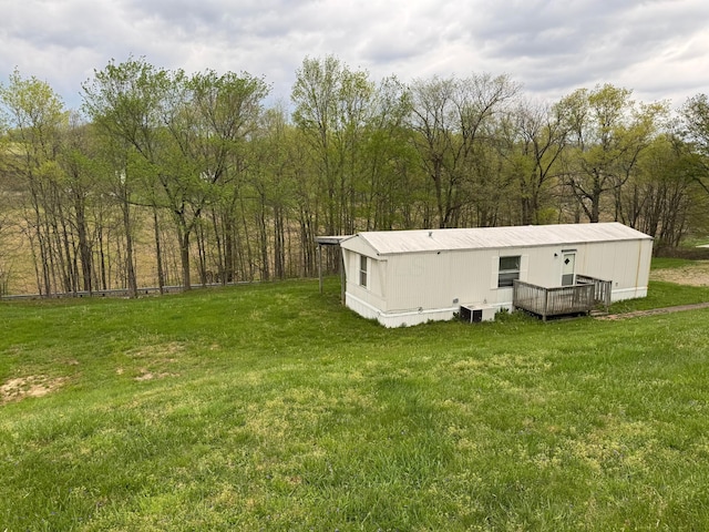 view of yard featuring a wooden deck