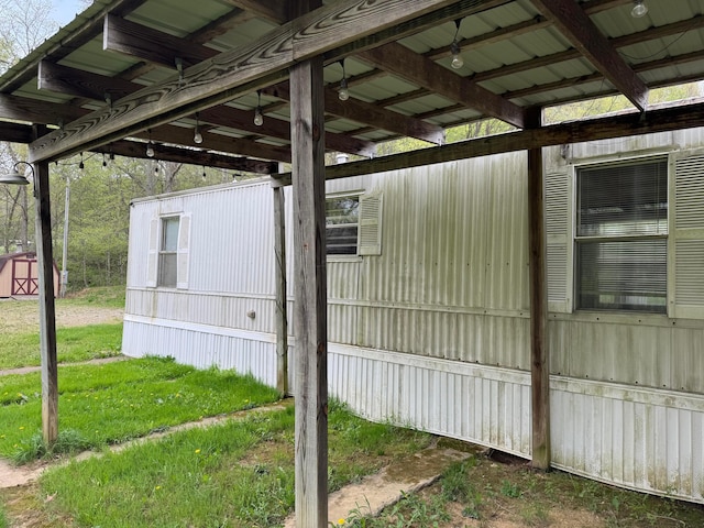 view of property exterior featuring a storage unit and an outdoor structure
