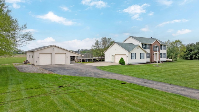 view of front of property with a front lawn and a garage