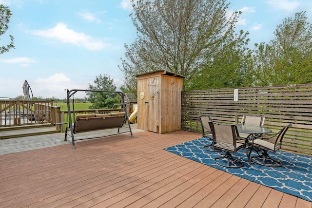deck with outdoor dining area