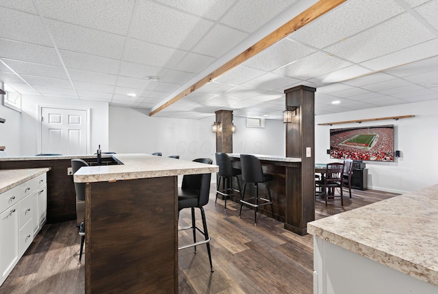 bar featuring recessed lighting, indoor bar, dark wood-style flooring, and a paneled ceiling