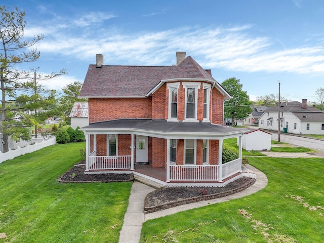 74 S Chester St, West Jefferson, OH 43162 - view of front of property featuring a porch, a chimney, a front yard, and brick siding