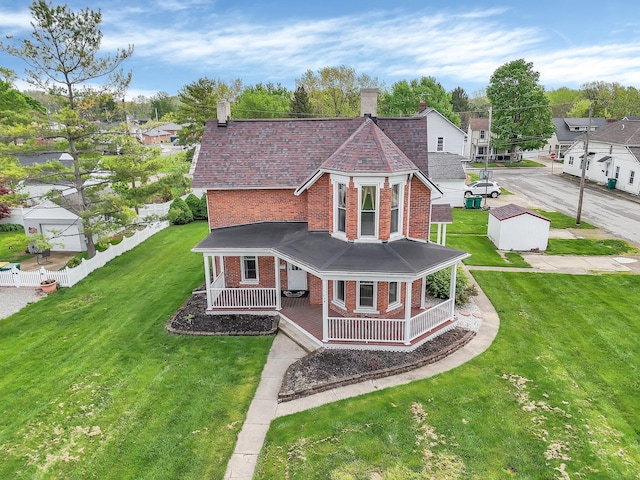 74 S Chester St, West Jefferson, OH 43162 - country-style home featuring brick siding, a front lawn, covered porch, and a chimney