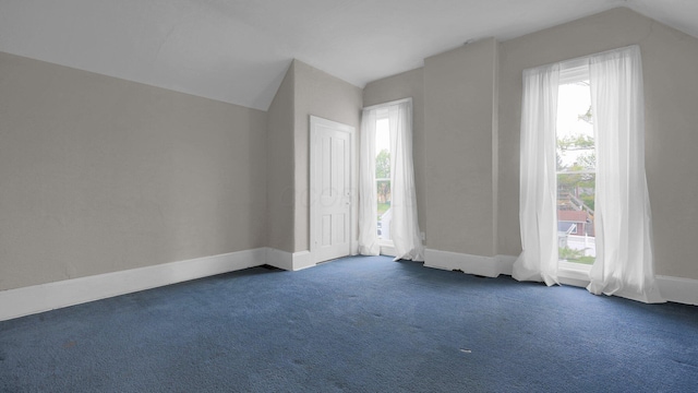 74 S Chester St, West Jefferson, OH 43162 - bonus room featuring baseboards, dark colored carpet, and lofted ceiling