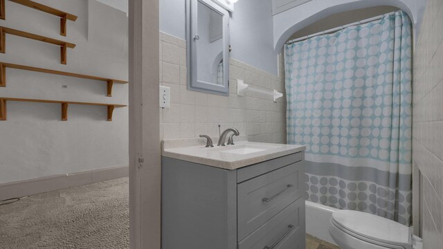 74 S Chester St, West Jefferson, OH 43162 - full bathroom with toilet, a shower with curtain, tile walls, and vanity