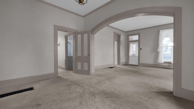 74 S Chester St, West Jefferson, OH 43162 - interior space featuring visible vents, crown molding, arched walkways, baseboards, and carpet