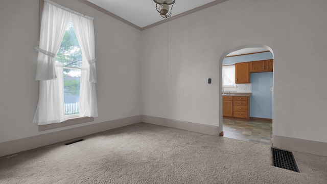 74 S Chester St, West Jefferson, OH 43162 - unfurnished room featuring a healthy amount of sunlight, arched walkways, and visible vents