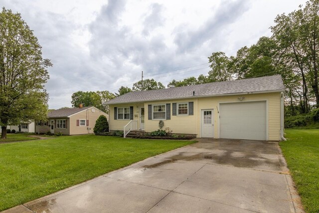 1234 E Fair Ave, Lancaster, OH 43130 - single story home with concrete driveway, a front lawn, and a garage