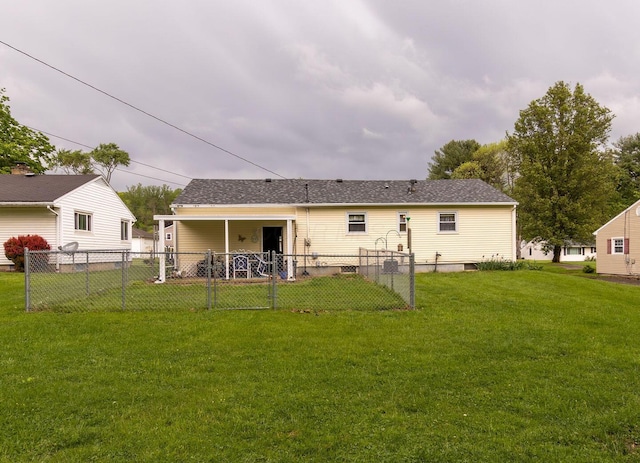 1234 E Fair Ave, Lancaster, OH 43130 - rear view of house featuring a gate, fence, and a lawn