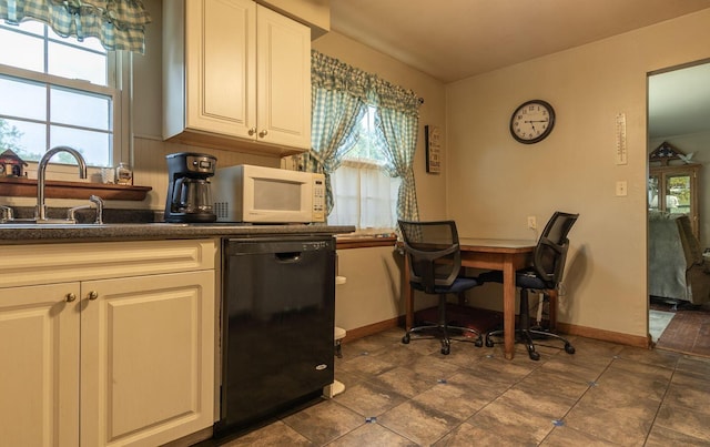 1234 E Fair Ave, Lancaster, OH 43130 - kitchen featuring dishwasher, baseboards, a sink, white microwave, and dark countertops
