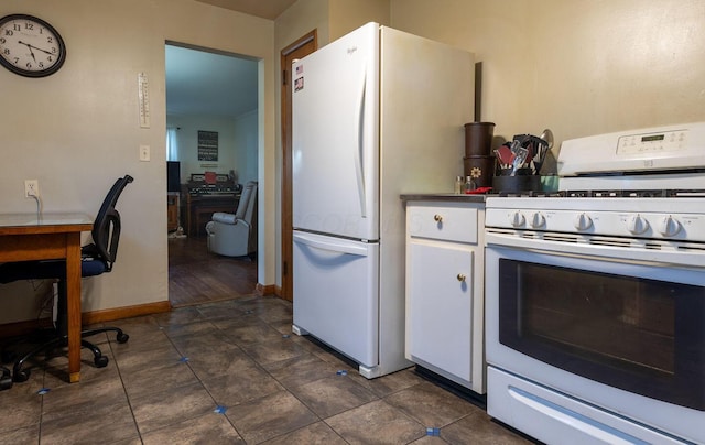 1234 E Fair Ave, Lancaster, OH 43130 - kitchen featuring white cabinetry, white appliances, dark countertops, and baseboards