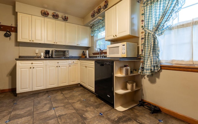 1234 E Fair Ave, Lancaster, OH 43130 - kitchen featuring white microwave, white cabinetry, baseboards, and black dishwasher