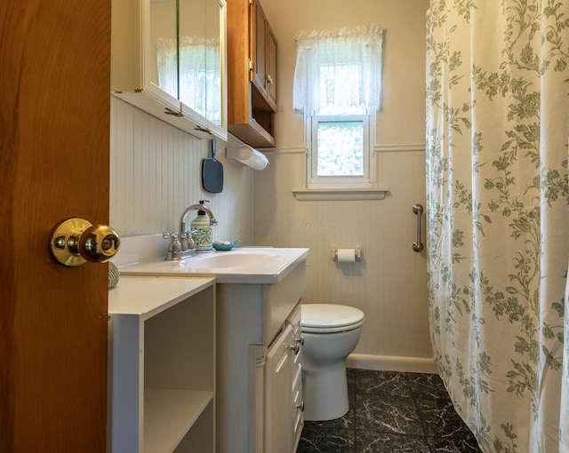 1234 E Fair Ave, Lancaster, OH 43130 - full bathroom with toilet, a wainscoted wall, marble finish floor, vanity, and curtained shower