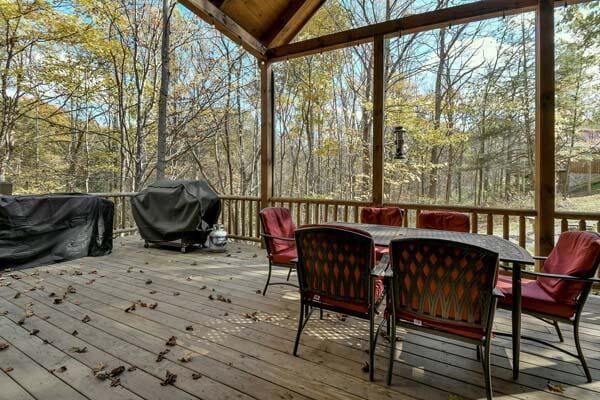 sunroom / solarium featuring outdoor dining space