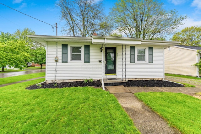 ranch-style home with a front yard