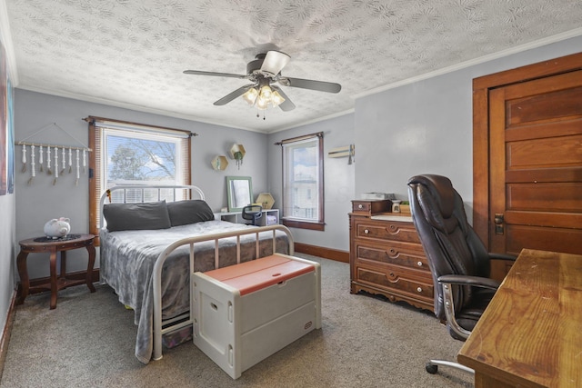 bedroom featuring a ceiling fan, multiple windows, ornamental molding, and carpet flooring