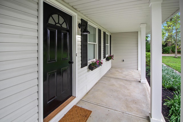 doorway to property featuring covered porch
