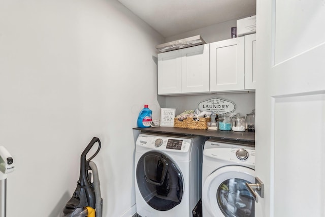 laundry area featuring cabinet space and separate washer and dryer