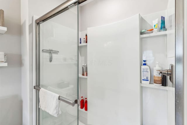 full bathroom featuring a shower stall