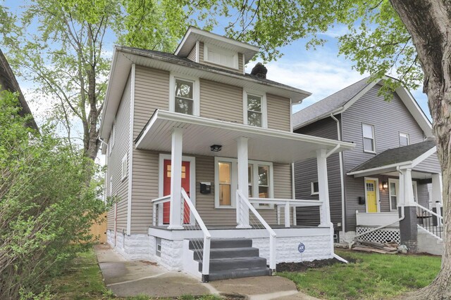 traditional style home featuring a porch