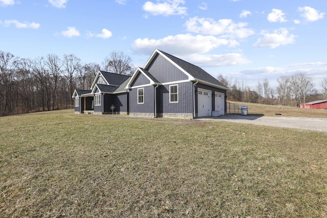 10695 State Route 93 N, Logan, OH 43138 - view of home's exterior featuring a lawn, driveway, and a garage