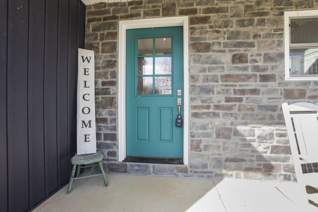10695 State Route 93 N, Logan, OH 43138 - property entrance featuring board and batten siding