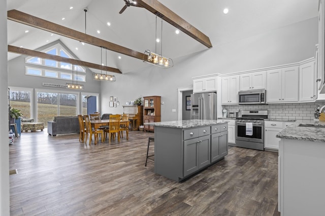 10695 State Route 93 N, Logan, OH 43138 - kitchen featuring appliances with stainless steel finishes, a sink, gray cabinetry, high vaulted ceiling, and beamed ceiling