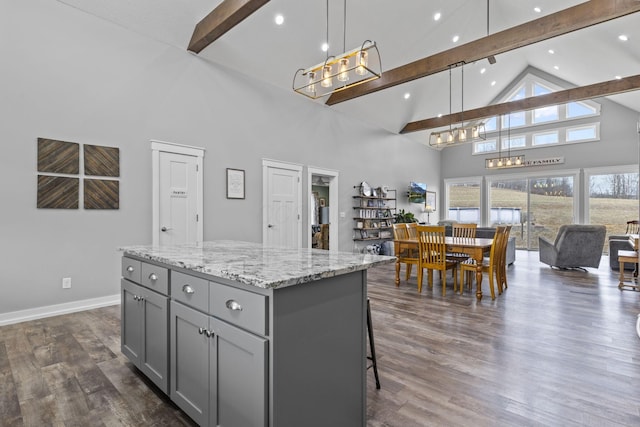 10695 State Route 93 N, Logan, OH 43138 - kitchen featuring a center island, beam ceiling, gray cabinetry, high vaulted ceiling, and an inviting chandelier