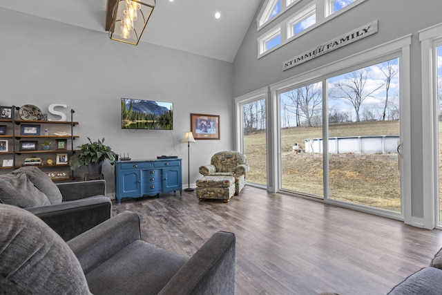 10695 State Route 93 N, Logan, OH 43138 - living room with plenty of natural light, baseboards, dark wood-style floors, and high vaulted ceiling