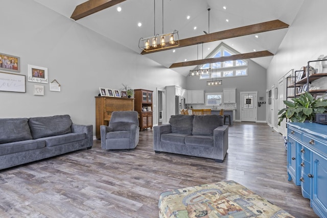 10695 State Route 93 N, Logan, OH 43138 - living area featuring beam ceiling, high vaulted ceiling, a chandelier, recessed lighting, and wood finished floors