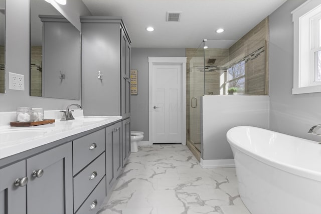 10695 State Route 93 N, Logan, OH 43138 - full bathroom featuring double vanity, visible vents, a freestanding bath, a shower stall, and marble finish floor