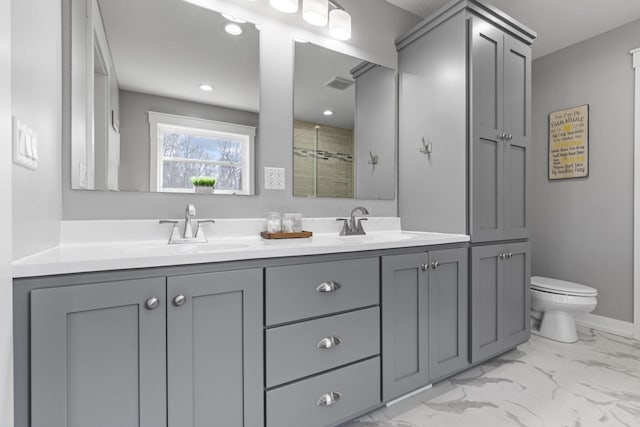 10695 State Route 93 N, Logan, OH 43138 - full bath featuring double vanity, marble finish floor, toilet, a sink, and a stall shower