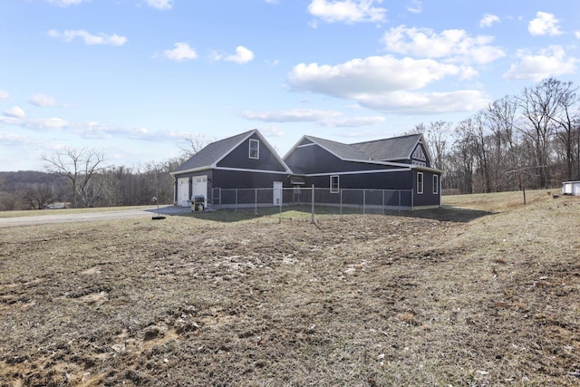 10695 State Route 93 N, Logan, OH 43138 - exterior space featuring an attached garage, fence, and driveway