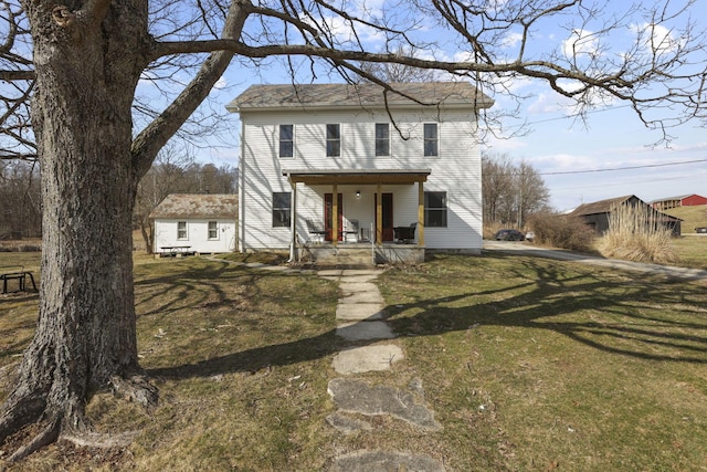 10695 State Route 93 N, Logan, OH 43138 - view of front facade with a porch, an outbuilding, and a front yard