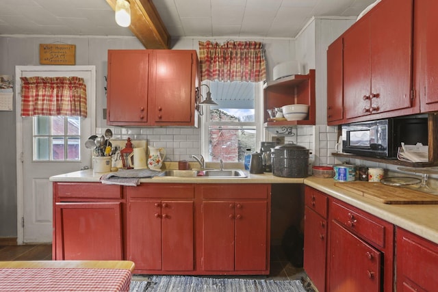 10695 State Route 93 N, Logan, OH 43138 - kitchen featuring a sink, open shelves, backsplash, and a healthy amount of sunlight