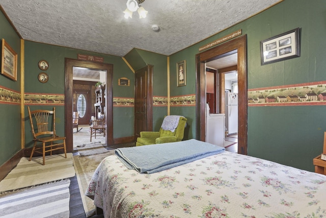 10695 State Route 93 N, Logan, OH 43138 - carpeted bedroom with freestanding refrigerator, a textured ceiling, and wainscoting