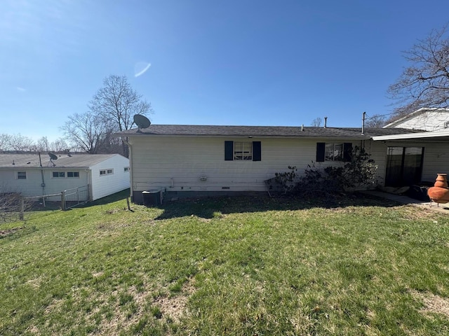 back of house with a lawn, fence, crawl space, and cooling unit
