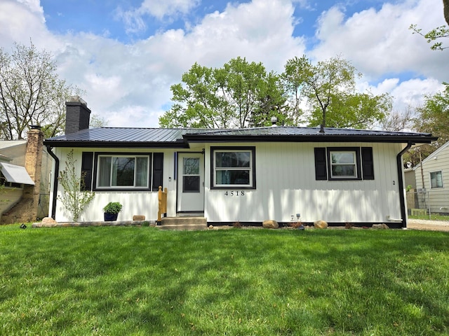 4518 Broadhurst Dr, Columbus, OH 43213 - ranch-style house featuring a chimney, a front lawn, and metal roof
